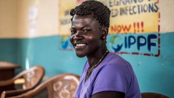 IPPF client from Uganda smiling, waiting for services 
