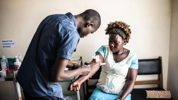 25-year-old Dorcas Lanyero gets blood test during a visit to the RHU clinic in Gulu. Lanyero was suffering from abdominal pain but received a full range of tests while she was there.