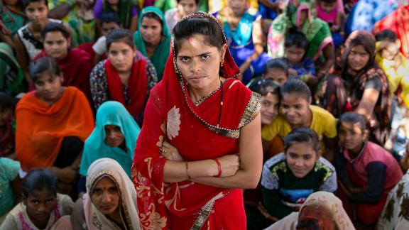 Indian woman standing with arms crossed
