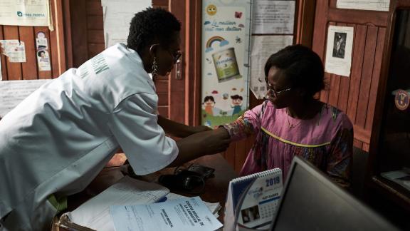 A woman received healthcare in Cameroon
