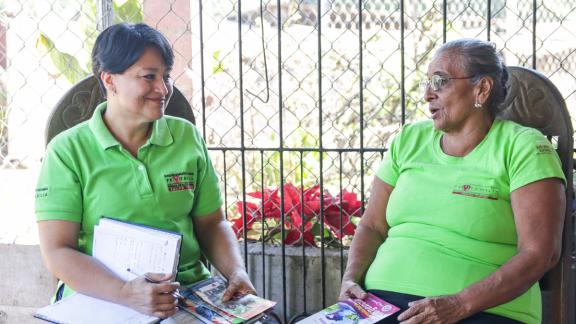 Two healthcare workers talking 