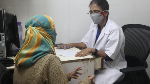 A healthcare worker with a client