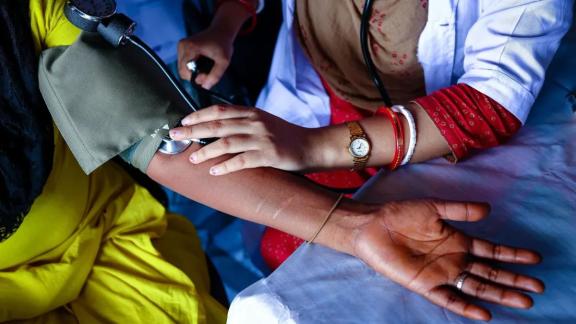 Paramedic Sraboni (25) is examining Rina (33) at the clinic built by IPPF. IPPF has established a clinic in Banishanta Brothel to provide all kinds of health services to sex workers working there, situated along the serene banks of the Pashur River in Mongla, Bangladesh. This brothel has endured countless cyclones and natural calamities; Cyclone Remal left an unprecedented impact. Almost every household in the village, comprising 92 families dependent on sex work, felt the brunt of this formidable cyclone. 