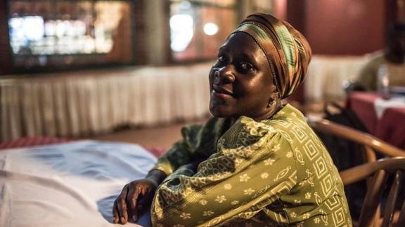 Joan, a former sex worker and beneficiary of the Lady Mermaid's Bureau project, photographed in a hotel in central Kampala.
