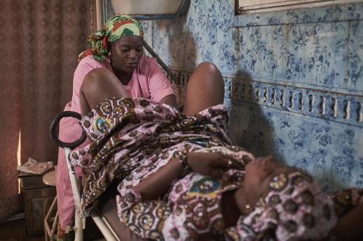 Mariame Doumbia treats a client at the mobile clinic
