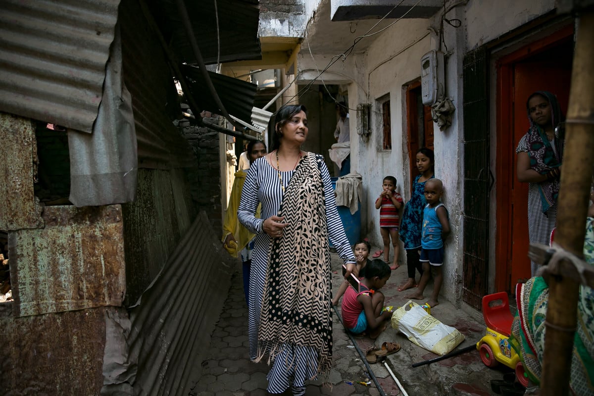 Shajahan is a link worker in the nearby Muslim district, where women pack into a house in the narrow village lanes to wait to speak to her